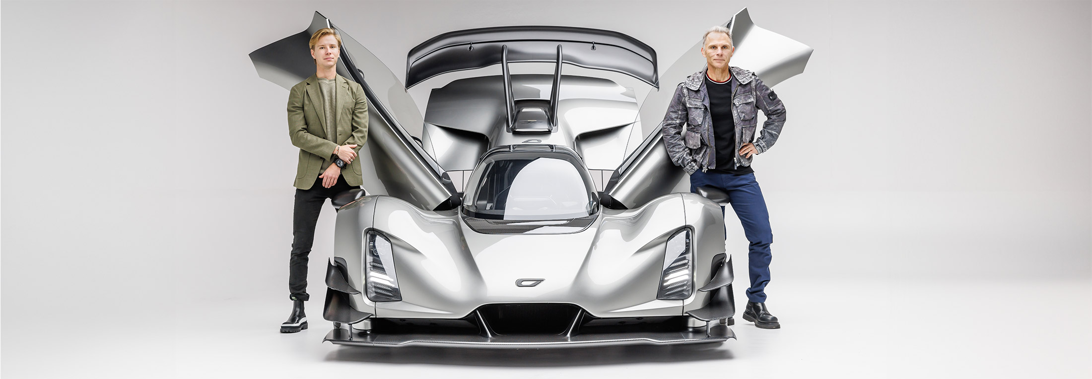 lukas and kevin czinger standing with their Czinger 21C hypercar